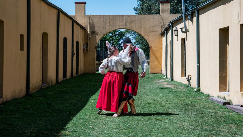 A couple in traditional gaucho attire dancing in Chascomús, Argentina.